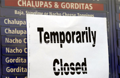 
                    A temporarily closed sign hangs at a Taco Bell restaurant December 7, 2006 in Philadelphia, Pa. Taco Bell restaurants in the Philadelphia area have closed voluntarily for testing after five people who dined there contracted an E. coli illness.
                                            (William Thomas Cain / Getty Images)
                                        