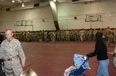 
                    Erickson joined 200 members of the 7th marine regiment at the base's West Gym. That was the staging area for the latest deployment from Twentynine Palms.
                                            (Pat Loeb)
                                        