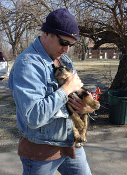 
                    Beauregard the puppy being rescued by Randy Grim.
                                            (Donna Lochmann)
                                        