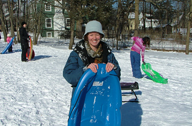 
                    Christina sledding on a snow day. Normally she would have spent that day in front of the television.
                                            (Christina Wall)
                                        