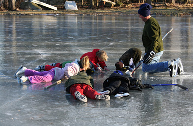 
                    Neighborhood kids checking out the "solar system" beneath the ice.
                                            (Stacy Fowle)
                                        