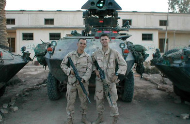 
                    Sean Huze with Matt Mylott in Diwaniyah, Iraq, May 2003.
                                            (Sean Huze)
                                        