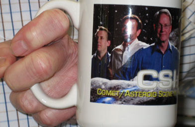 
                    Don Yoemans' mug says: "CSI: Comet/Asteroid Scene Investigation." His motto is, "Saving the earth one asteroid at a time."
                                            (Krissy Clark)
                                        