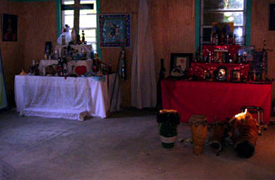 
                    Inside the temple are two altars. The red one for the more turbulent spirits, including Dantor, from whom New Orleanians ask for protections from hurricanes.
                                            (Eve Troeh)
                                        