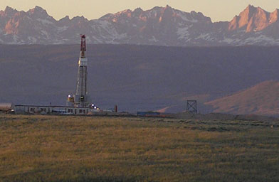 
                    The Wind River Mountains overlook drilling rigs in the natural gas fields near Pinedale, Wyo.
                                            (Duane Calvert)
                                        