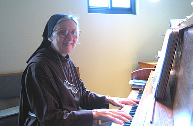 
                    Sister Loretta, the aunt of reporter Kelly McEvers, at the piano in the convent chapel.
                                            (Kelly McEvers)
                                        