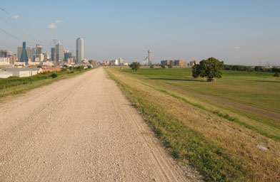 
                    Service roads run atop the 29-foot-high levees north of downtown Dallas.
                                            (Julia Barton)
                                        