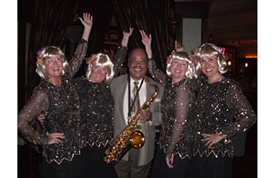 
                    The Caskettes at Bing Crosby's Restaurant and Piano Lounge in Rancho Mirage, Calif. (left to right:  Delna, Mimi, John the saxophone player, CindyLee, Babs)
                                            (Cynthia Ryan)
                                        