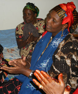 
                    Somali Bantu women clap and sing to the music playing in Omar's apartment.
                                            (All photos by Ann Heppermann, Kara Oehler and Laurel Simmons)
                                        