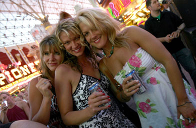 
                    Country music fans pose during the daytime Academy of Country Music All Star Concert at the Fremont Street Experience in Las Vegas, Nev.
                                            (Michael Buckner / Getty Images)
                                        