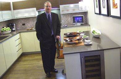 
                    Gordon Absher shows off the kitchen of a City Center condo.
                                            (Michael May)
                                        