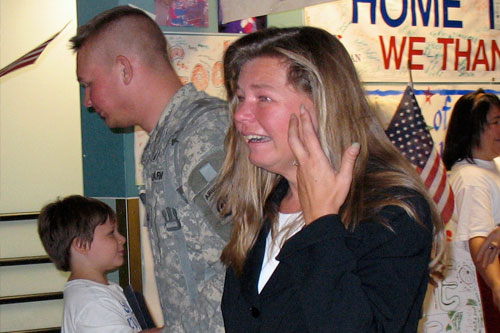 
                    A happy mother picks up her son returning from Iraq on R&R leave.
                                            (Julia Barton)
                                        
