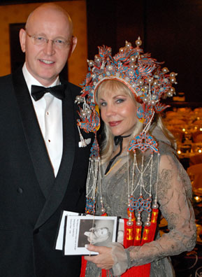 
                    Willem Plegt, General Manager of InterContinental Hotel with Carolyn Farb, who is wearing a Chinese headdress at the Chinese Community Center gala.
                                            (Colt)
                                        