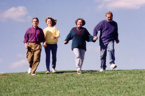 
                    (L to R:) John and his wife Debbie; and Bill's wife Kelly and Bill running down a hill.
                                            (Chris Gildenstern)
                                        