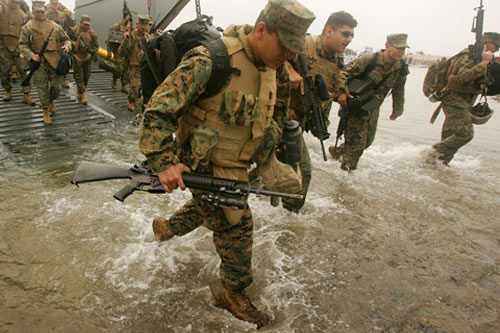 
                    Marines and sailors returning from the war in Iraq to Camp Pendleton, California on May 30, 2007. Many returning service men and women find great difficulty in readjusting back to civilian life.
                                            (David McNew/Getty Images)
                                        