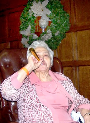 
                    Michael Idov's grandmother Lidia, seen here celebrating one of five possible winter holidays. Note the holiday wreath behind her.
                                            (Yelena Zilberman)
                                        