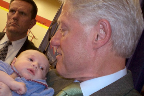 
                    Technically, he's not running for president any more, yet former President Bill Clinton nevertheless took time to hold young William Joseph McNarney after speaking at a middle school in Carlisle, Iowa,  on Dec. 30, 2007.
                                            (Courtesy Michael McNarney)
                                        