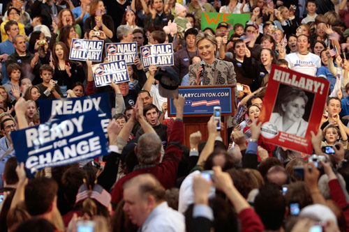 
                    Presidential candidate Sen. Hillary Clinton (D-NY) acknowledges a cheering crowd of supporters after she is declared the winner of the New Hampshire primary. The word "change" is on her campaign signs and banners as well.
                                            (Chris Hondros/Getty Images)
                                        