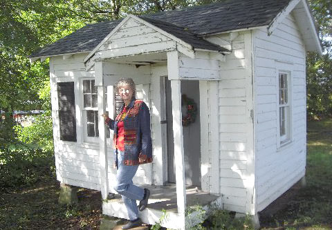 
                    Lucinda stands on the porch of her playhouse in 2007.
                                            (Courtesy Lucinda Alsobrook Coulter-Burbach)
                                        