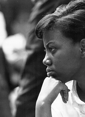 
                    A young woman listens to speakers during a civil rights rally on August 28, 1963 in Washington, D.C.
                                            (Courtesy National Archive/Newsmakers)
                                        
