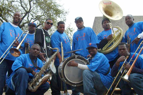 
                    One of many permutations of The Free Agents Brass Band of New Orleans, La.: (from top left to right) Alfred Growe (trombone), Free Agents Brass Band co-founder Shannon Haynes (trumpet) Renard Henry (snare drum), Ersel Bogan (trombone), Julian Gosin (trumpet), Herbert "MC" Carver Jr. (tuba), Chad Brown (trumpet). 

From bottom left to right:  John Gilbert, (saxophone), the band's other co-founder and bass drummer Ellis Joseph and Gregory Jones (trombone).
                                            (Terence King)
                                        