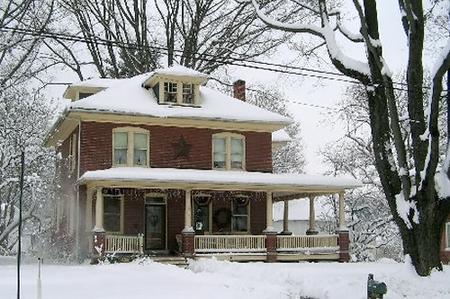 
                    Nephin-Bish's home during the last snowfall in Lancaster, Pa.  Nephin-Bish says high heating oil costs make it tough to keep it warm.  Many of their weekends are spent at home, reading or watching movies.
                                            (Courtesy Eileen Nephin-Bish)
                                        