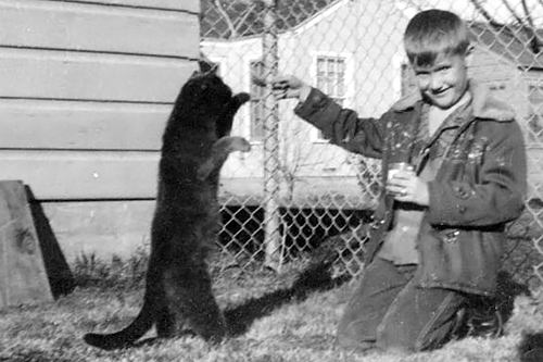 
                    Weekend America listener Harley Hansen at age 7 with his kitty, Pepper, in Fort Worth, Texas.
                                            (Courtesy Harley Hansen)
                                        
