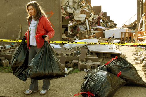 
                    Sophomore Kristin Parnell, with bags of her belongings that she salvaged from her dorm room at Union University in Jackson, Tenn. More than 40 people were victims of tornadoes that tore through Arkansas, Kentucky, Mississippi and Tennessee on Feb. 5, 2008.
                                            (Rick Gershon/Getty Images)
                                        