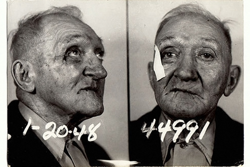 
                    This man was arrested in 1948. Many people in the photos aren't in good shape when taken into custody.
                                            (Courtesy Steidl & Partners Publishing)
                                        