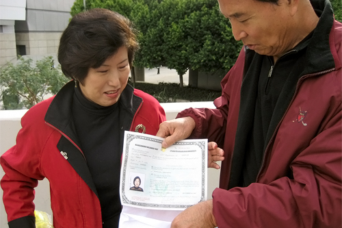 
                    Angela's parents safeguard the naturalization papers that her mother was recently awarded.
                                            (Angela Kim)
                                        