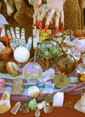 
                    Luanne Hughes has worked as a psychic on the Venice Beach Boardwalk in California for 17 years. Her workspace is filled with crystals and beads from all over the world, and her stack of tarot cards.
                                            (Shirley Shin)
                                        