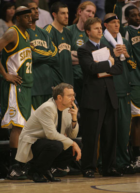 
                    Head coach P.J. Carlesimo of the Seattle SuperSonics and his team watch their lead dwindle late in the game against the Phoenix Suns on Feb. 8, 2008.
                                            (Domenic Centofanti/Getty Images)
                                        