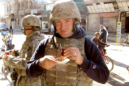 
                    Reporter Adam Allington enjoys a tea break with a group of soldiers in downtown Ramadi.
                                            (Sgt. Clyde Rhoads)
                                        