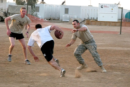 
                    Soldiers from Missouri playing a pick-up game of touch football.
                                            (Adam Allington)
                                        