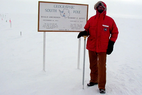 
                    Nathan Tift with a sign marking the geographic South Pole, where he lived and worked as a meteorologist in 2001.
                                            (Nathan Tift)
                                        