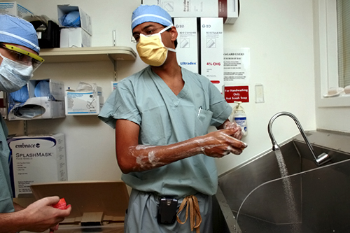
                    Surgeon and writer Dr. Atul Gawande scrubs up before an operation.
                                            (Laura Hanafin)
                                        