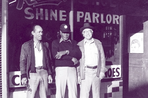 
                    Photo collector Red Powell (right) and friends in front of his shoe-shine parlor in 1970. Powell's business was located in San Francisco's Fillmore District, once an epicenter of San Francisco's African-American community. The walls of Powell's shop were lined with photos depicting the neighborhood's hey-day as an international jazz destination.
                                            (Reprinted with permission of Chronicle Books, courtesy of The Red Powell/Reggie Pettus Collection.)
                                        