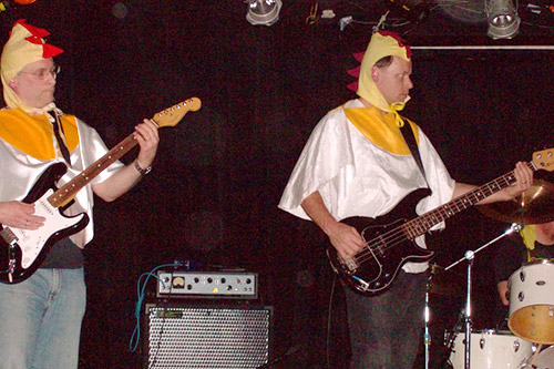 
                    Joe and Tom Chicken performing in Chicken Starship's last performance together. The band has chosen to use the surname "Chicken" in performance -- partially in tribute to the Ramones, and partially to protect their reputations.
                                            (Jill Moe)
                                        