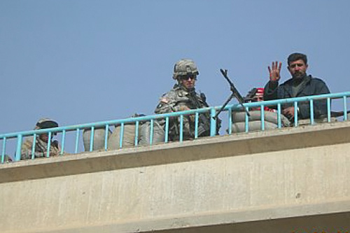 
                    Capt. Phillip Carter visiting an Iraqi police checkpoint in Baqubah, February 2006. Capt. Carter was there to check the status of the police checkpoint's weapons and ammunition.
                                            (Courtesy Phillip Carter)
                                        