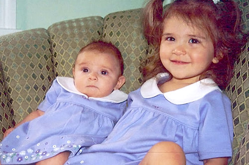 
                    Lillian (right) and her new baby sister weeks after her second birthday.
                                            (Courtesy Scot Case)
                                        
