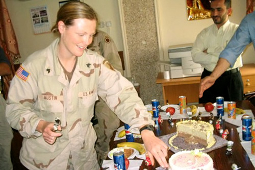 
                    Sandi Austin served in Iraq as a sergeant with the 445th Civil Affairs Battalion, in Samarra and Mosul. This is a photo of her birthday party in Mosul's City Hall in May 2004. She now lives in Monterey, Calif., with her newborn baby daughter.
                                            (Courtesy Sandi Austin)
                                        