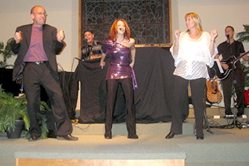 
                    A picture of an event that followed a self-marriage celebration that Weekend America guest Ken Donaldson conducted (left to right): Ken Donaldson, Terez Hartman, a musician who performed at the ceremony, and Rev. Kathryn Morrow, who officiated.
                                            (Courtesy Ken Donaldson)
                                        