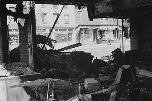 
                    Smoldering ruins in the nation's capital after rioting in reaction to King's assassination. Scores of other U.S. cities were scarred by rioting in April 1968.
                                            (Library of Congress)
                                        