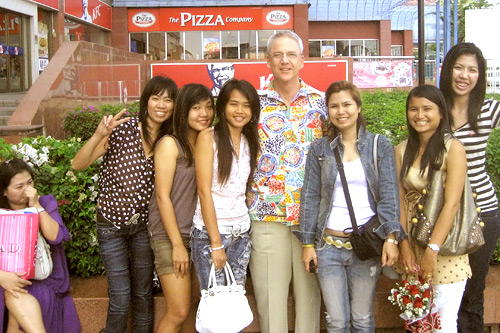 
                    Peter Maxon, independent producer David Maxon's father, pictured with young Thai women set to go bowling as a get-to-know-you event.
                                            (Courtesy Paul Maxon)
                                        