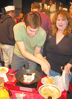 
                    Gallagher Lawson works to become a two-time Grilled Cheese Champion.
                                            (Kevin Rolly)
                                        