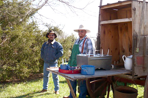 
                    Josh Hoy (right) catered the food for the event. The menu included local cheese curd, home-canned okra and buffalo-barley meatballs.  Hoy runs the nearby Flying W Ranch and lodge.
                                            (Sylvia Gross)
                                        