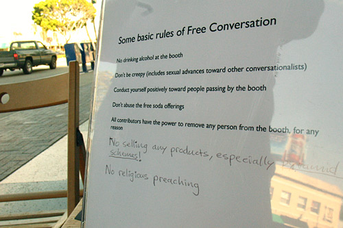 
                    The Conversation Booth Rules include directives such as: "Don't be creepy" and "Conduct yourself positively towards other people passing the booth." The newest rules are written in pen at the bottom.
                                            (Ekene Okobi)
                                        