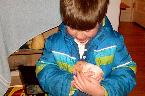 
                    Charlie Moe reunited with his hamster.
                                            (John Moe)
                                        