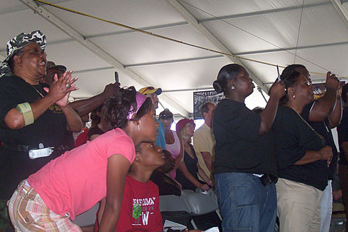 
                    Fans cheer on The Worship Squad at their Gospel Tent performance, April 26, 2008.
                                            (Lawrence Lanahan)
                                        