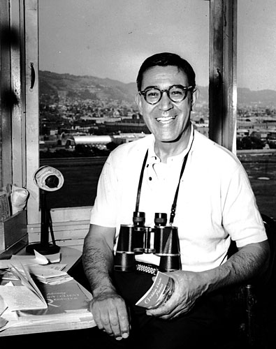 
                    Joe Hernandez at Golden Gate Fields. He lost a considerable amount of weight after suffering a heart attack in the autumn of 1963. Going into the 1963-64 season at Santa Anita Park, his streak of calling races stood at 10,980 in a row.
                                            (Courtesy Caballo Press of Ann Arbor and Frank Hernandez. All rights reserved.)
                                        